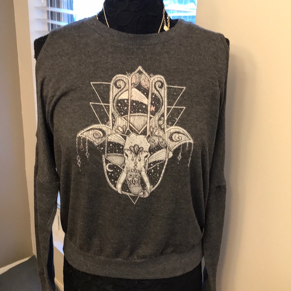 about a girl sweatshirt with open upper arms size L
